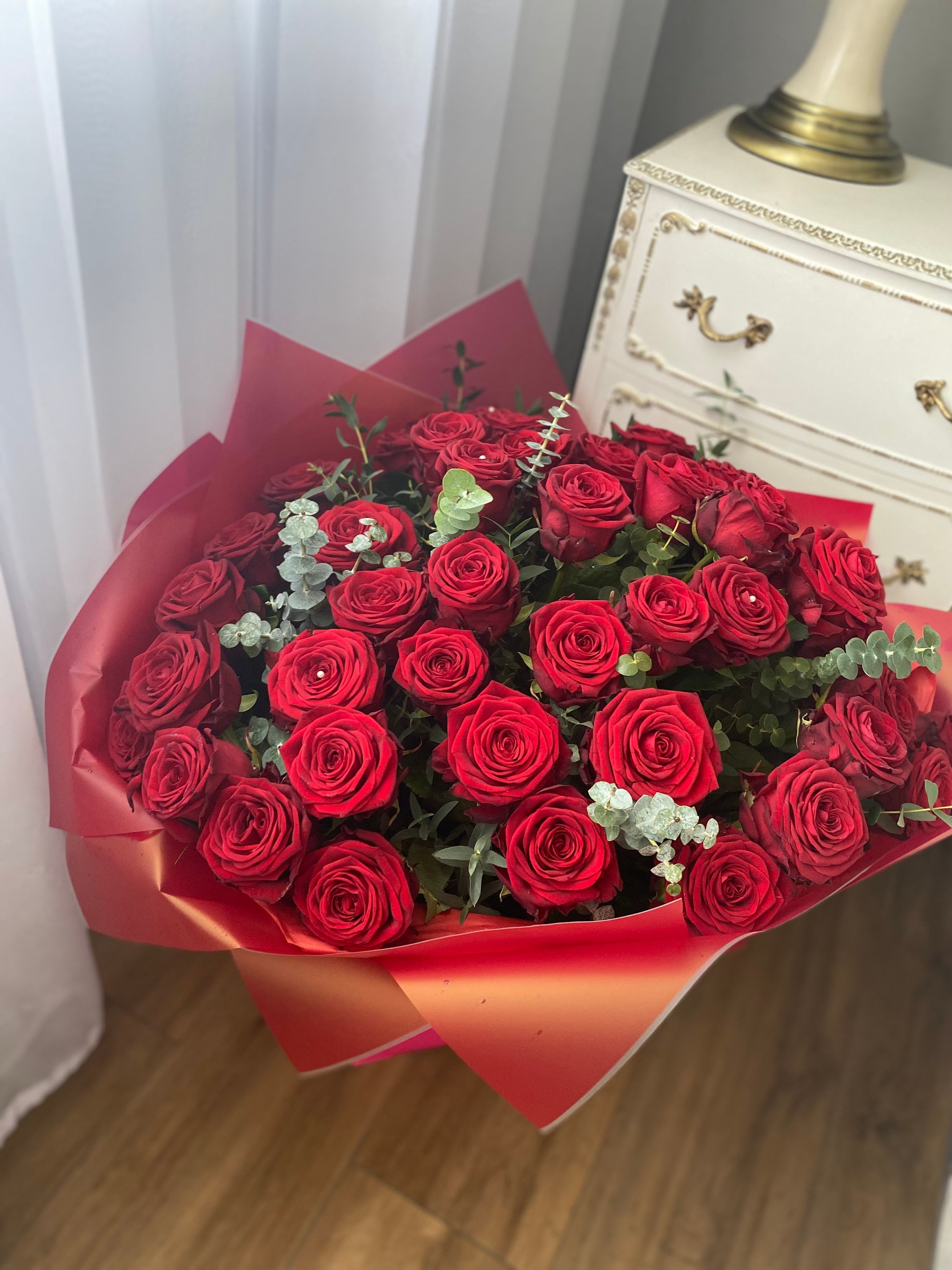 Premium red roses hand-tied by expert florist